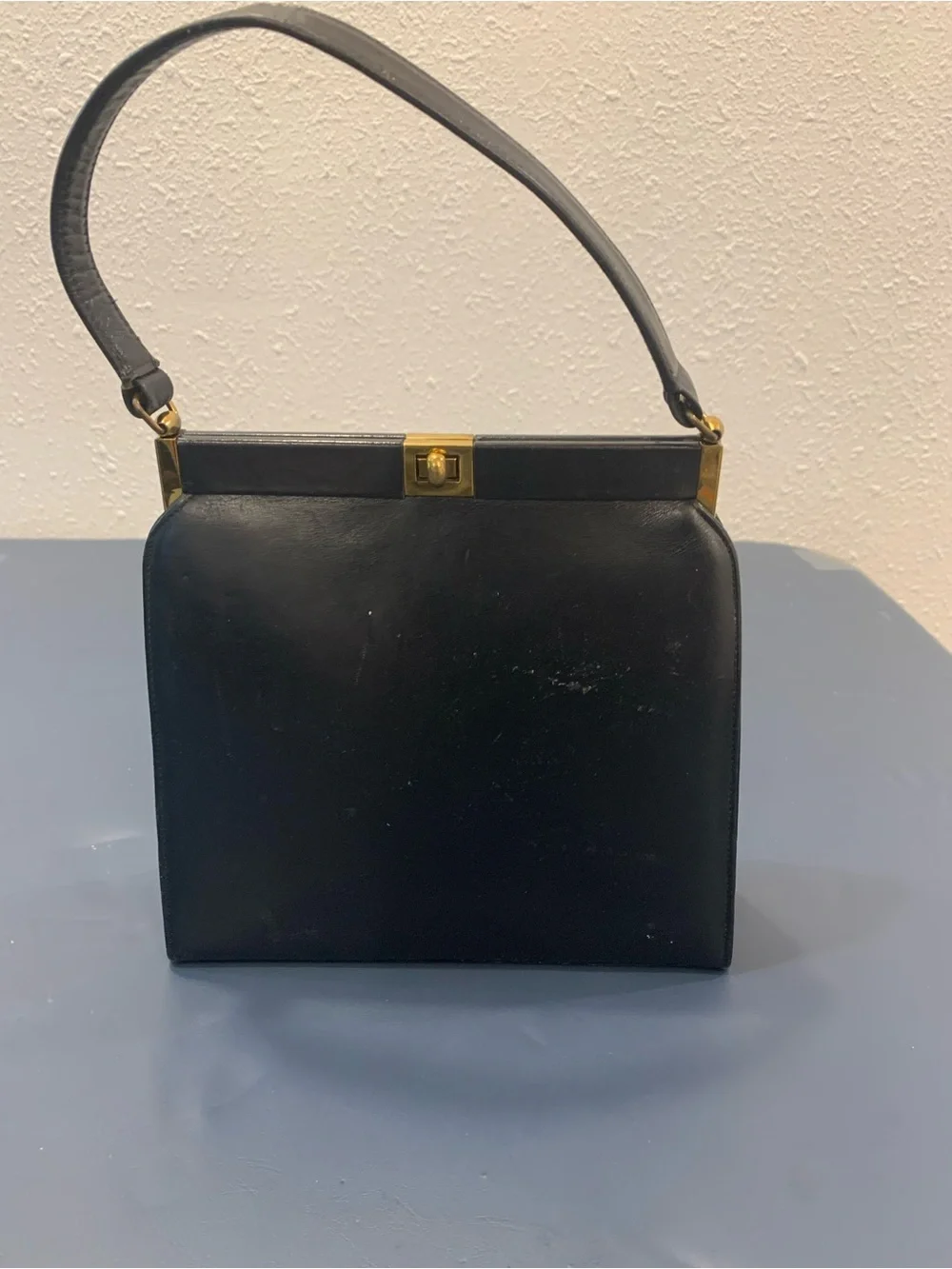 Classic Black Leather Top-Handle Bag with Gold Hardware